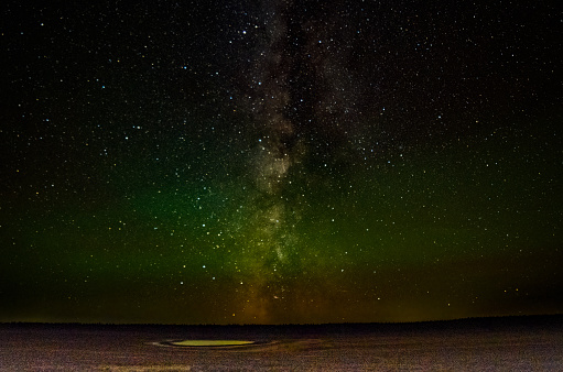 Stars, Northern Lights over Montana northern Prairie in western USA of North America. This is north of Lavina on Red Hill Road with a large lake in view. Nearest cities are Roundup and Billings, Montana.