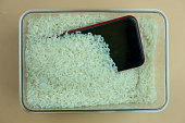 Mobile phones is embedded with rice from falling on water.