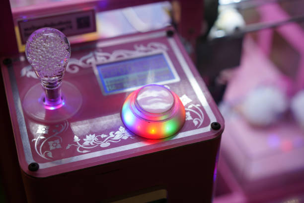 kid play claw game in asia arcade for hapiness and fun
