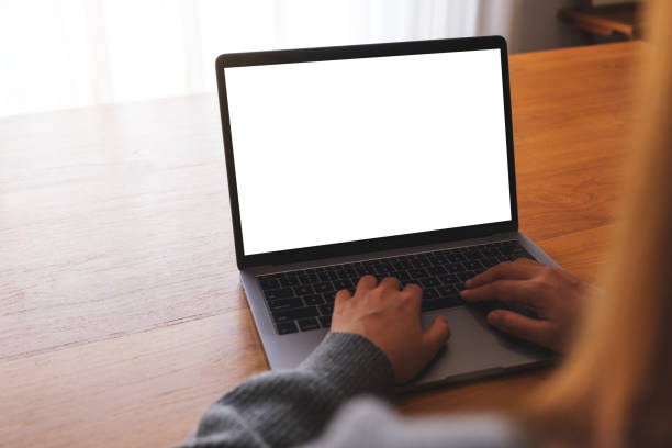 istock Mockup image of a woman using and working on laptop computer with blank white desktop screen 1730772135