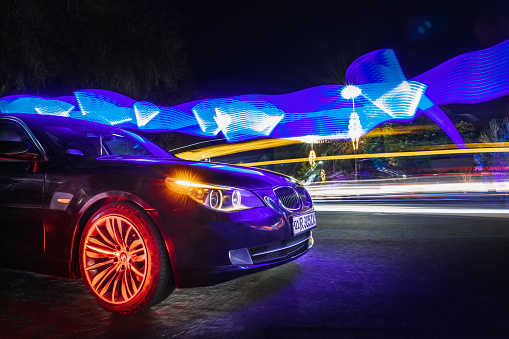 Tashkent, Uzbekistan - March 22, 2023: BMW brand car in the city in interesting lighting