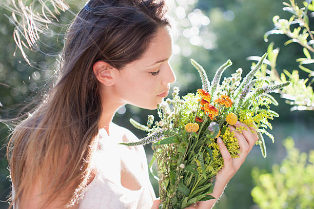Woman holding bouquet of flowers aroma smell stock pictures, royalty-free photos & images