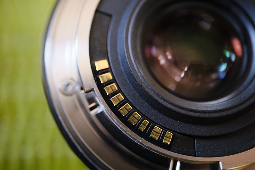 Close-up of camera lens electronic contacts