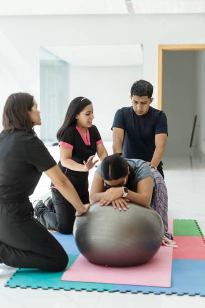 istock Instructor explains to young man how to help with exercises that provide comfort to his pregnant wife 1730879183