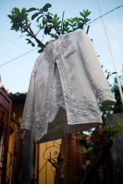 istock the groom's clothes were hung on a tree branch 1730879207