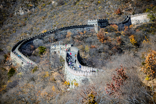 Simatai Great Wall in the mountains of Beijing, China in autumn, people climb the Great Wall to enjoy the scenery