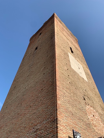 perspective of the tower of Barbaresco, famous town in the Langhe, wine production area in Italy