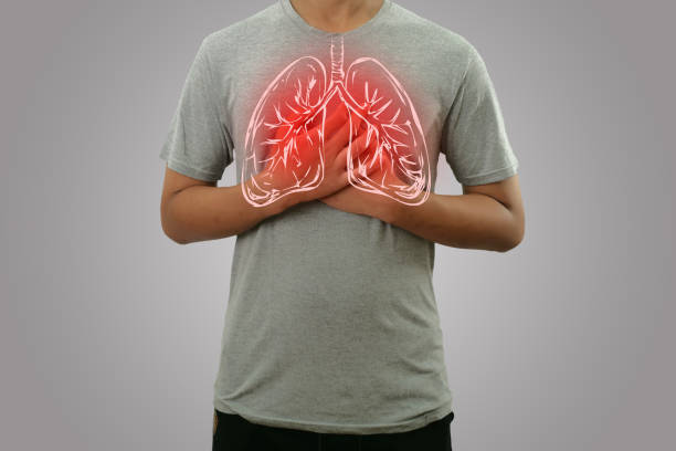 Male person holding chest, feeling pain with lung illustration on the torso, respiratory system disease stock photo