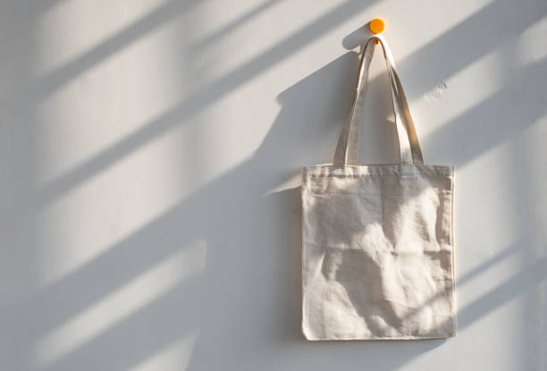Textile shopping bag hanging from hook.
