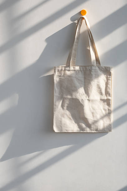 istock Textile shopping bag hanging from hook. 1730937540