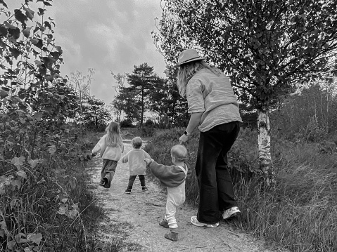 Young mother having a walk in the heatland park