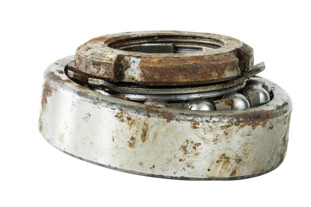 istock Bearing on a white background. Old worn bearing covered with rust 1730941809