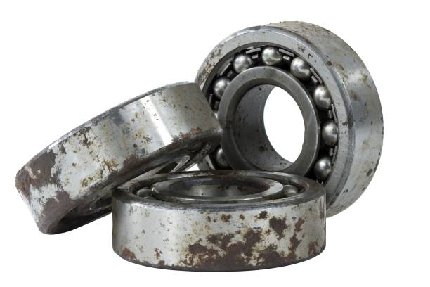 istock Bearing on a white background. Old worn bearing covered with rust 1730941814
