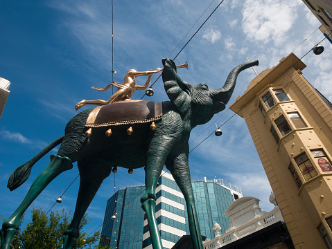 South Australia, Australia – December 4, 2022: Low angle view of Triumphant Elephant bronze sculpture by Salvador Dali on display in Rundle Mall in Adelaide.
