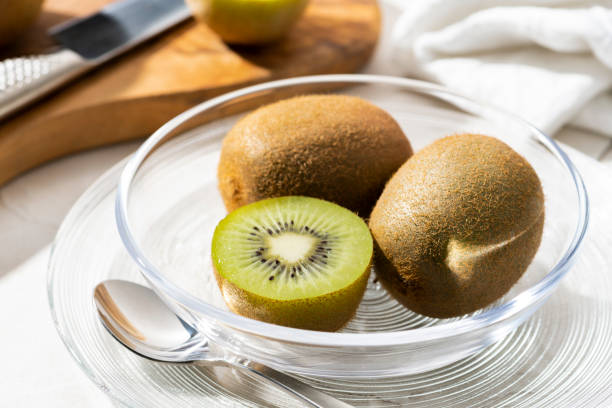 istock Placing Freshly Cut Kiwi in a Glass Bowl 1730945013
