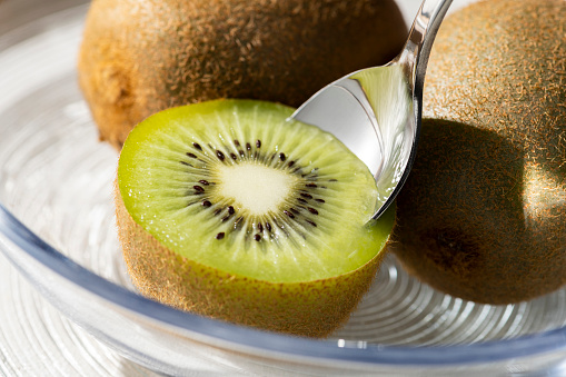 Eating Sliced Kiwi with a Spoon