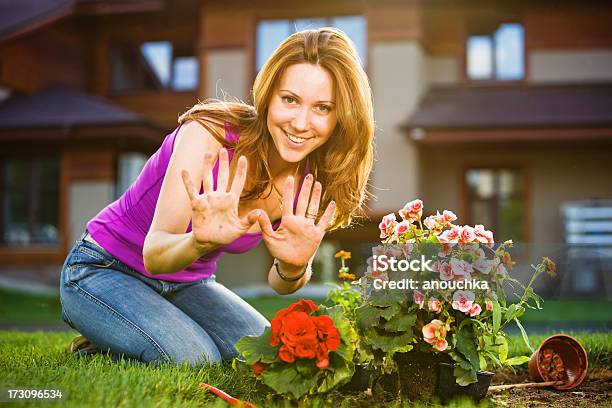 Woman Showing Her Durty Hands While Planting Flowers In Garder Stock Photo - Download Image Now