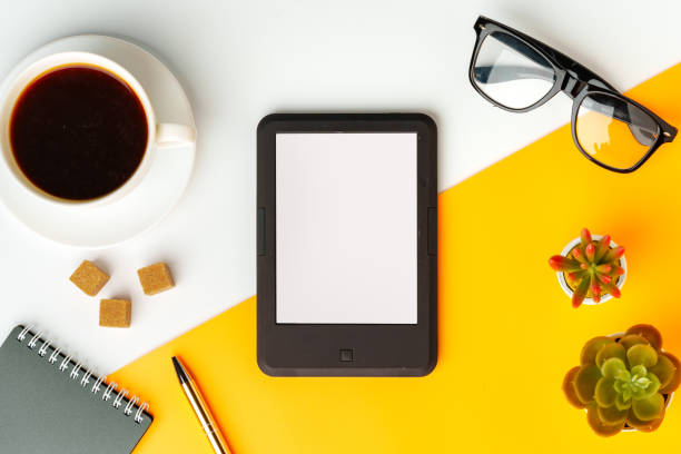 istock E-book reader with coffee cup and glasses on white and yellow background 1730994310