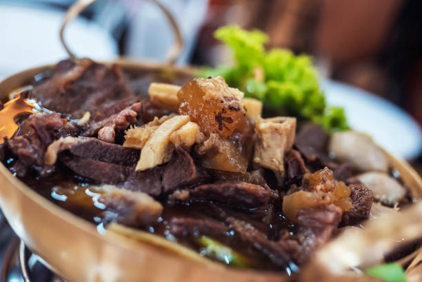 istock Braised beef in a brass pan set on the gas stove 1731014847