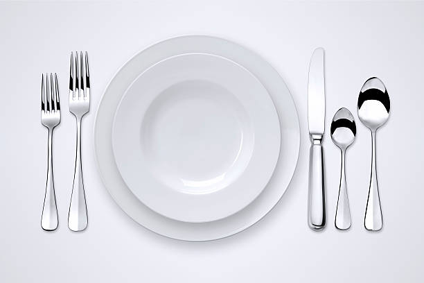Table Setting With Clipping Paths Table setting with clipping path for the plates, forks, spoons and knife. upper class photos stock pictures, royalty-free photos & images