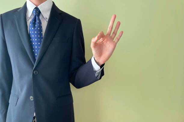 A man taking an OK pose A young office worker taking an OK pose independence document agreement contract stock pictures, royalty-free photos & images