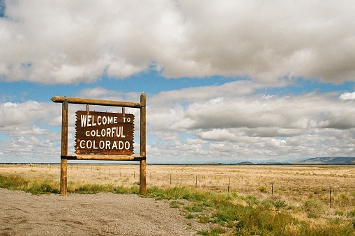 Welcome to Colorado sign alongside highway