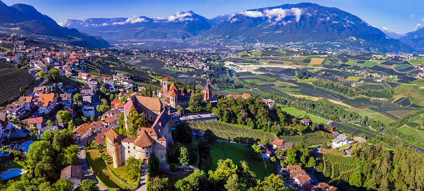 Tourism of northen Italy.  Traditional picturesque mountain village Schenna (Scena) near Merano town in Trentino - Alto Adige region. aerial drone high angle view