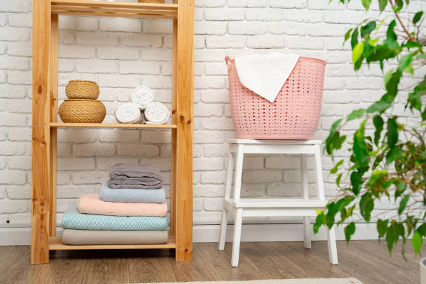 istock Pink plastic laundry basket in a bathroom 1731039803