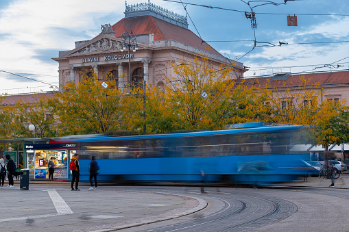 Zagreb, Croatia 10-10-2023 The central square with the typical blue tram in front of the Glavni Kolod train station in Zagreb. It is the largest station in Croatia and the main hub of Croatia