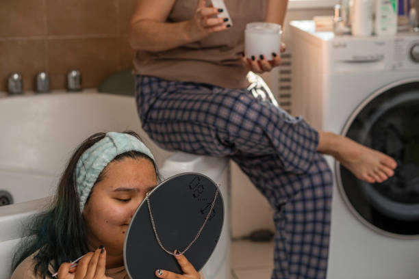 Dawn of Wellness: Asian Girls Nurture Themselves with Careful Morning Routine stock photo