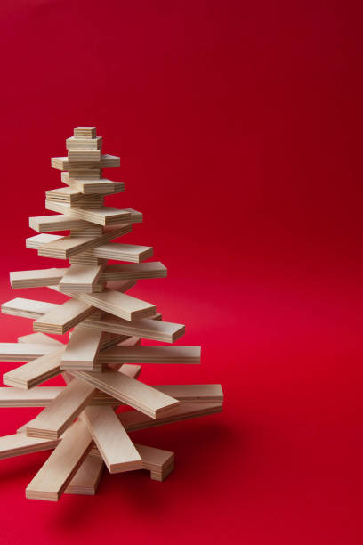 istock symbol Christmas tree from a wooden on red background 1731077722