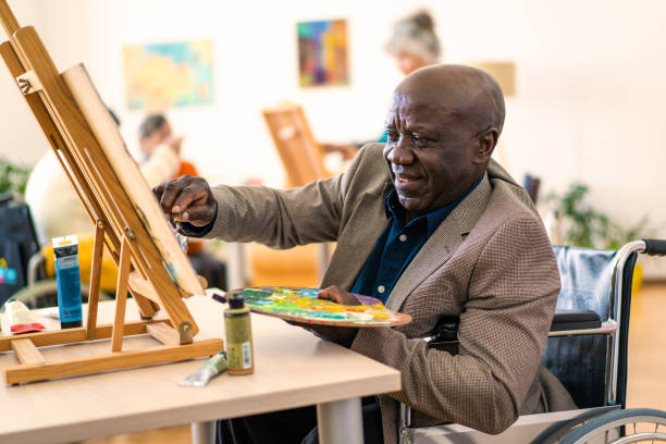 istock Happy retired man painting on canvas for art therapy 1731092686