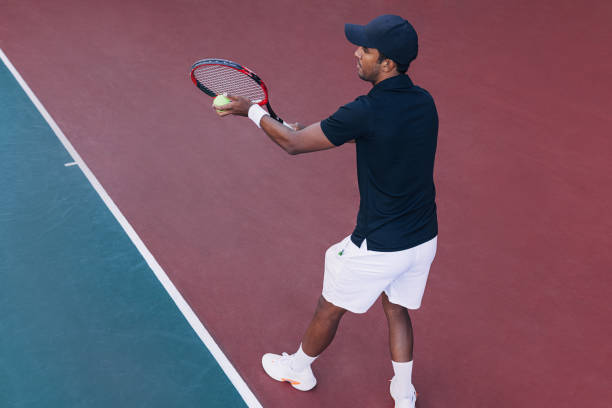 istock Young male tennis player ready to serve 1731129876