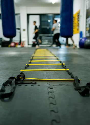 Agility ladder on floor for exercising in boxing gym