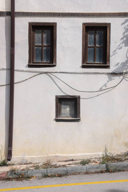 Face like  wooden window shutter on building exterior.