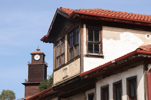 Old clock tower and old house windows in Mudurnu