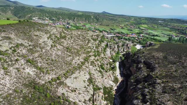 Video of drone approaching the village over rocks