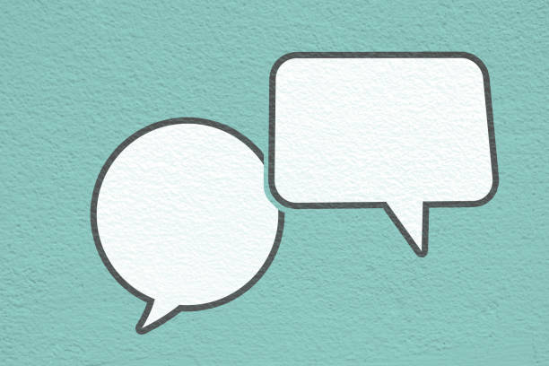istock Conceptual image about communication and social media, customer feedback, Blank couple white speech bubble on grunge blue concrete wall 1731161537