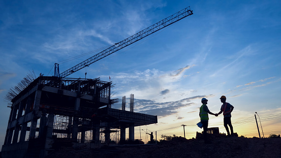 Engineer Teamwork Concept,Worker team join hands together in construction site.