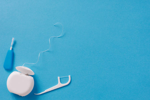 istock Dental floss and toothpicks on blue background 1731170145