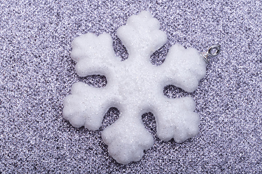 snowflake on festive shiny background