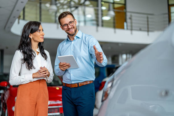 istock Beautiful caucasian female client customer choosing new car. 1731251679