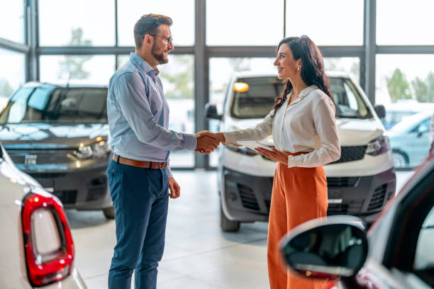 istock Handshaking in a car showroom 1731258487