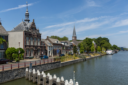 Nieuwegein, the Netherlands. 12 June 2023. Cityscape of Jutphaas with Former Town Hall and church along the canal. “Blauwe Brug” in the distance.