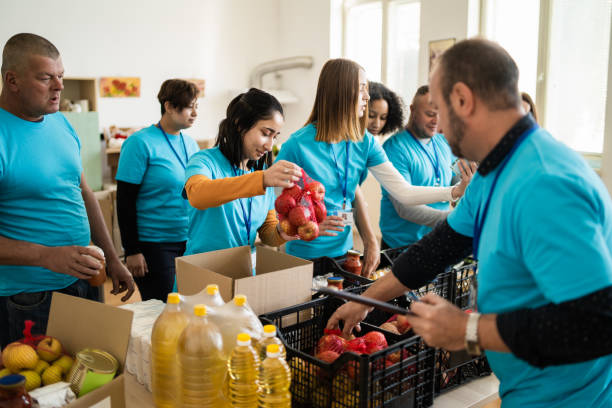 istock Aid workers assembling emergency food packages for displaced people 1731259706