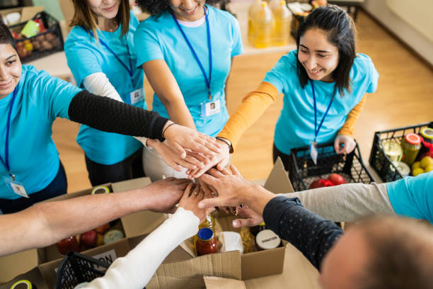 istock Matching t-shirts and stacking hands 1731259728