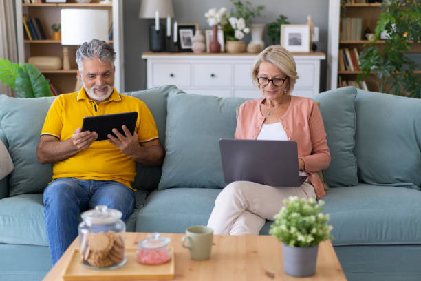 istock Senior couple at home using laptop and tablet 1731262605