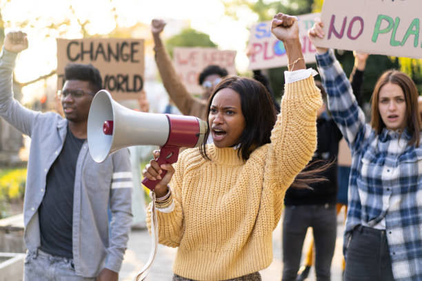 istock Group of activists protesting outdoors 1731263843