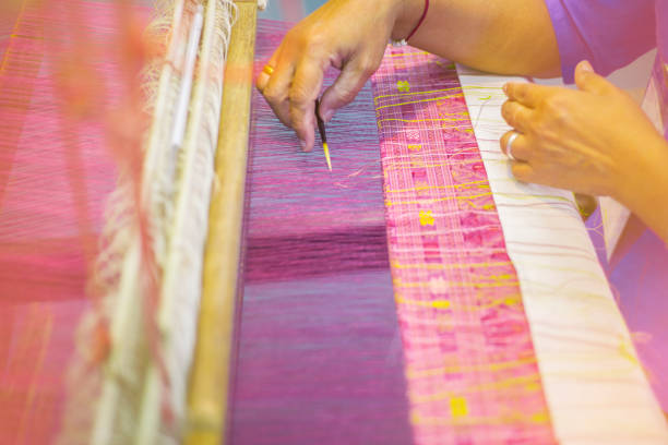 Hands working on weaving traditional local handicrafts