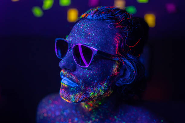 istock Portrait of a man's face under UV lights 1731264407